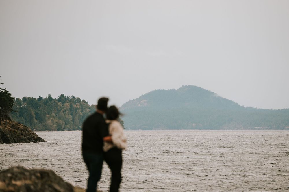 Neck Point Park, Nanaimo, Vancouver Island Engagement Photographer Photoshoot of couple hugging and looking at mountains