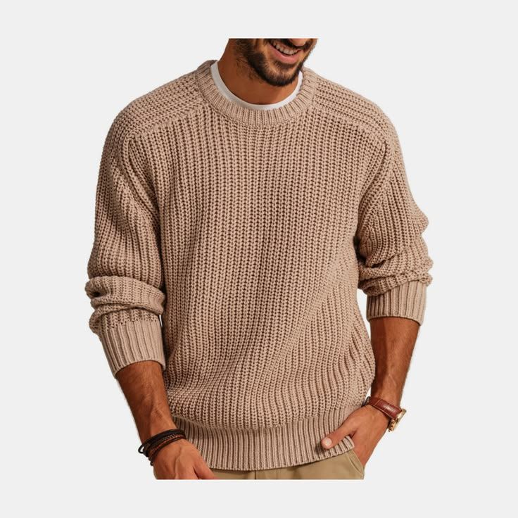 Man wearing a tan chunky waffle-knit crewneck sweater with raglan sleeves and a relaxed casual fit.