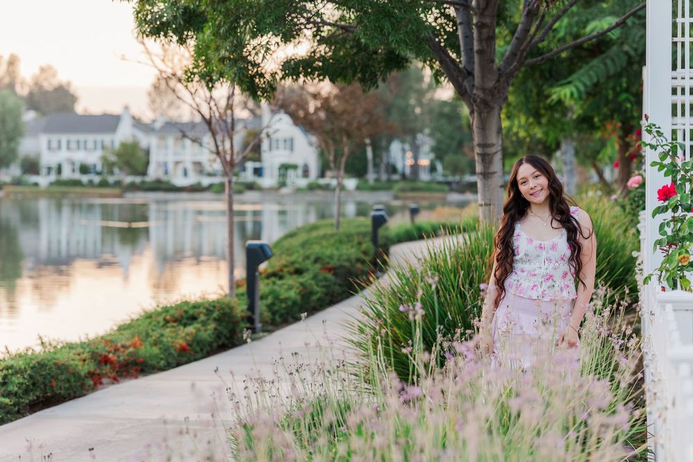 A collection of outdoor portraits taken along a lakeside path with lush landscaping.