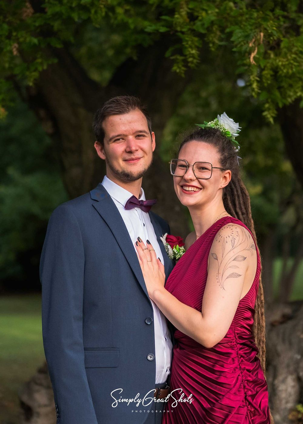 Eastwood Hall wedding photographer captures a bridesmaid and her boyfriend in the gardens of the wedding venue