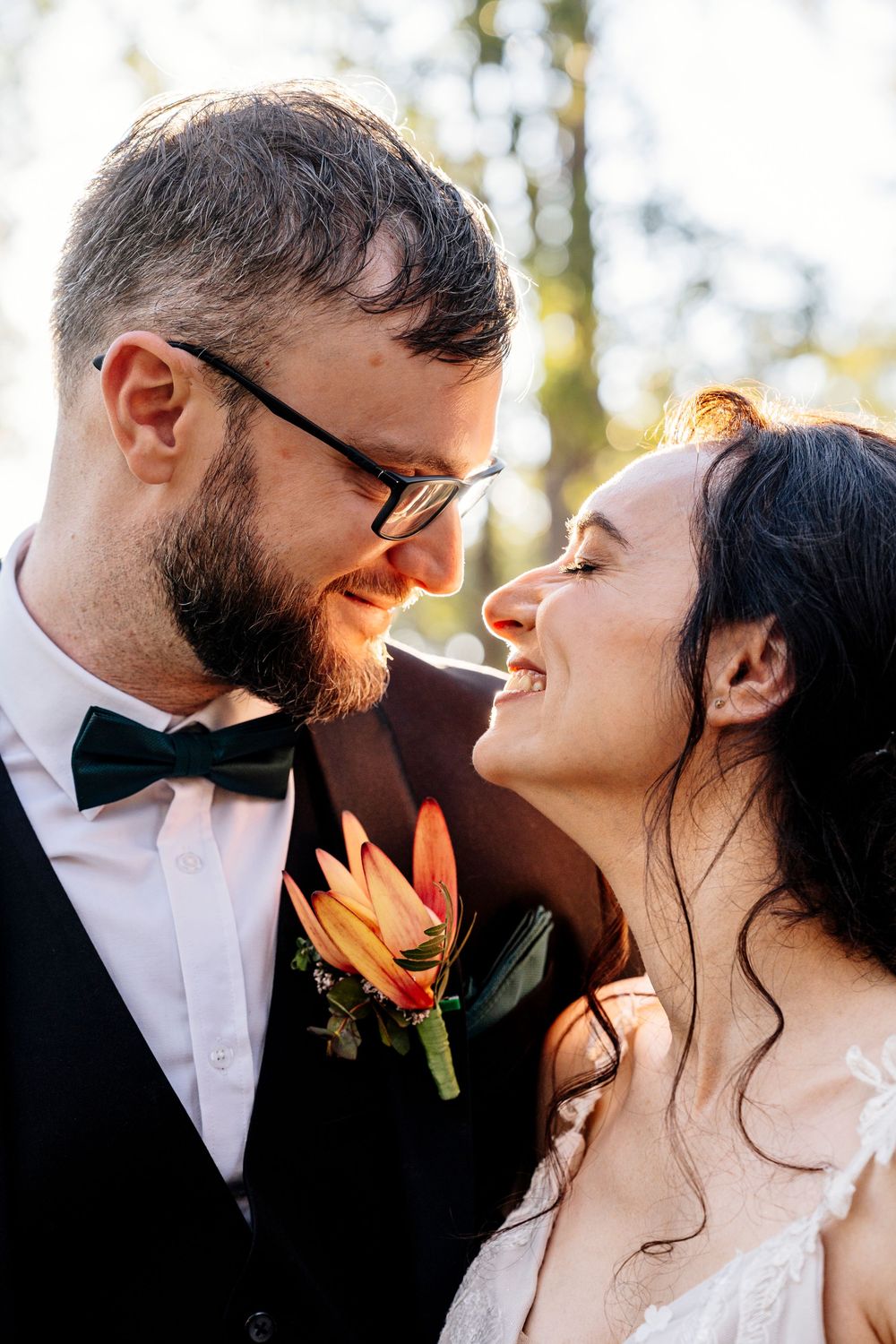 A romantic collage of wedding photos showing intimate close-up moments between a couple in formal attire outdoors.
