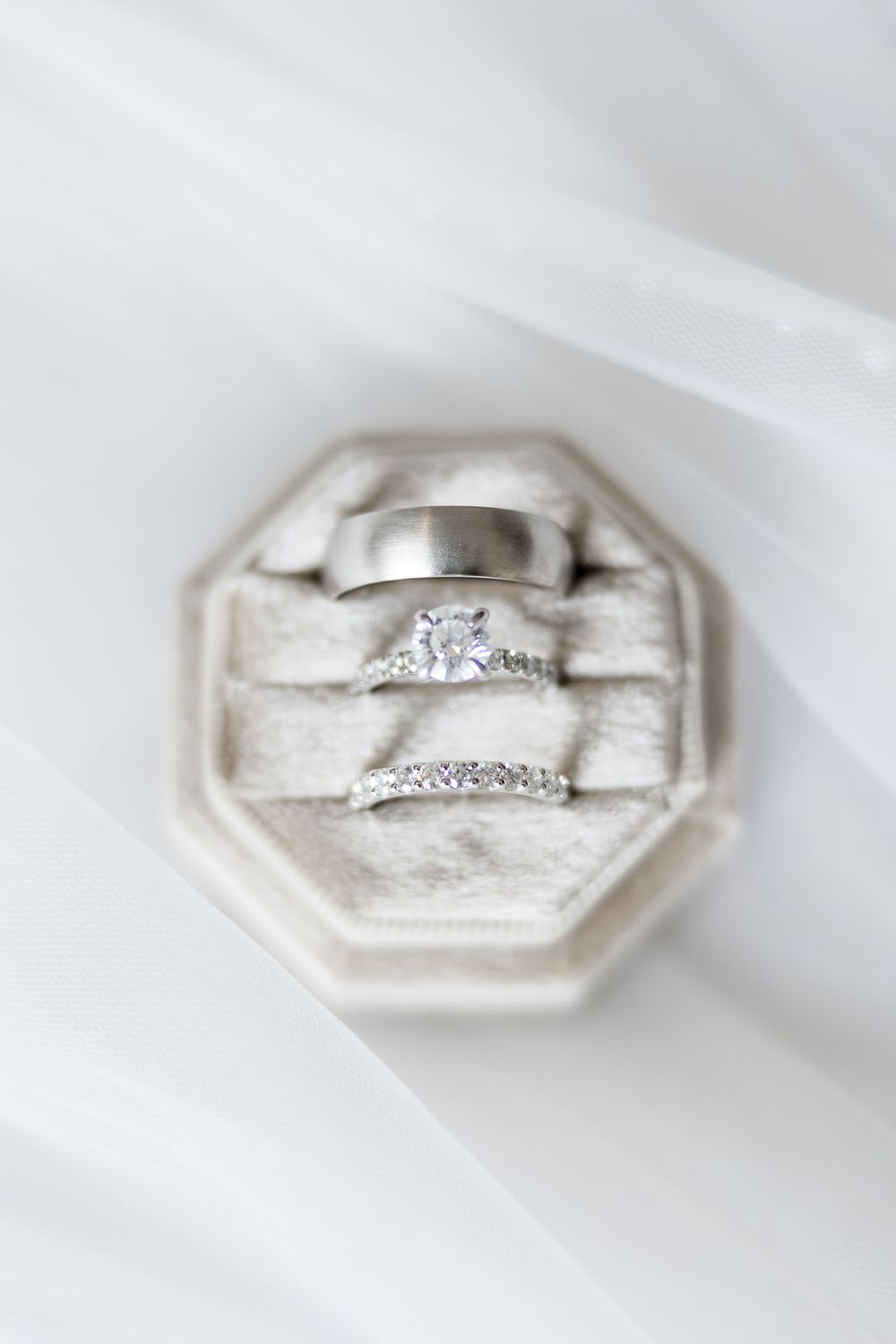 Close-up sequence of a sparkling diamond engagement ring in white gold or platinum setting.