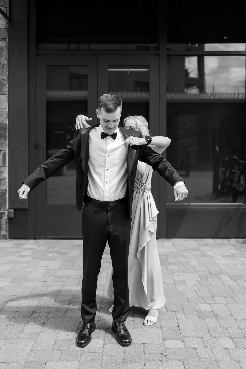 Black and white photo showing dance steps marked on outdoor pavement.