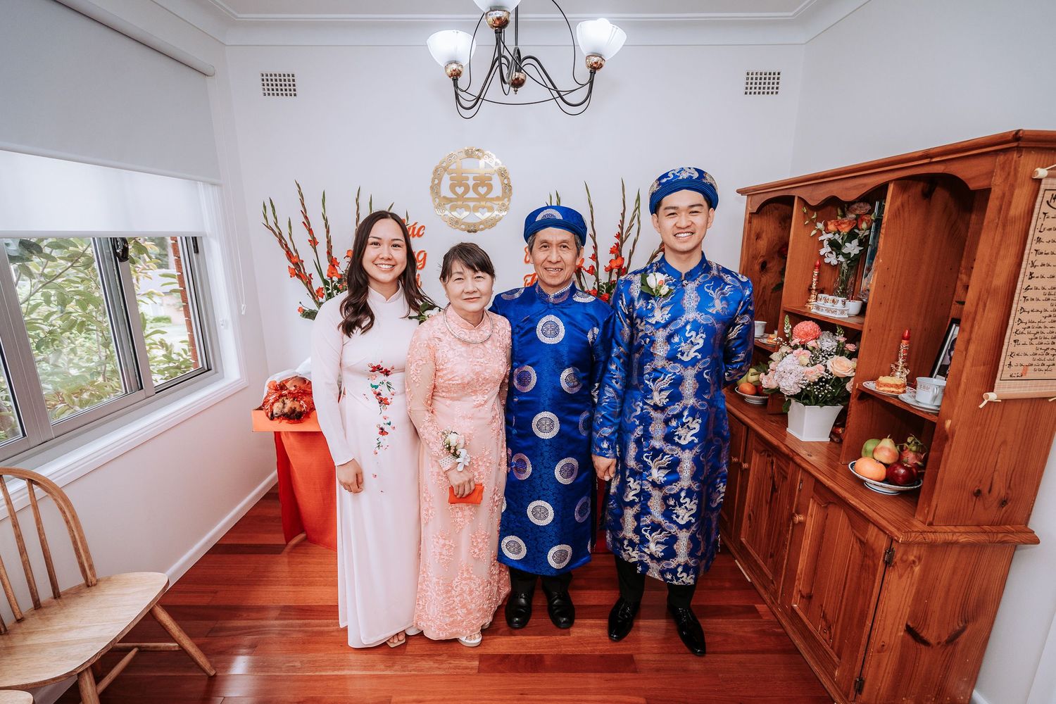 Wedding celebration in elegant venue with traditional Vietnamese cultural elements.