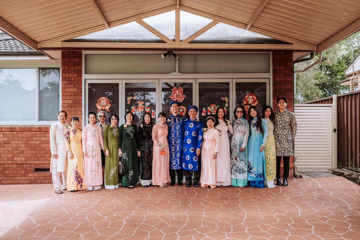Exterior view of a brick wedding venue with covered entrance and gathering space.