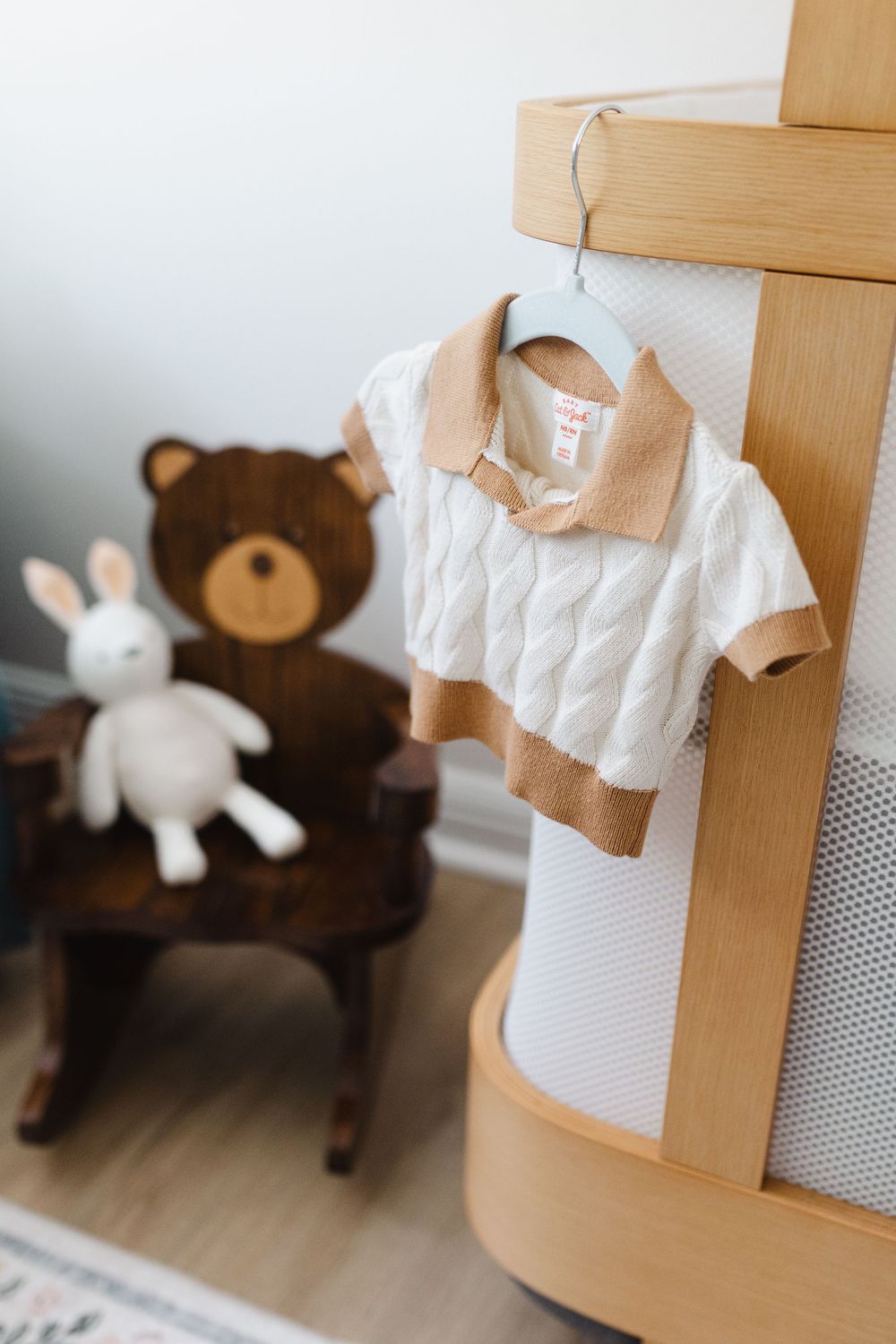 A series of photos showing a white paper towel roll holder mounted on a wooden post with stuffed animals nearby.