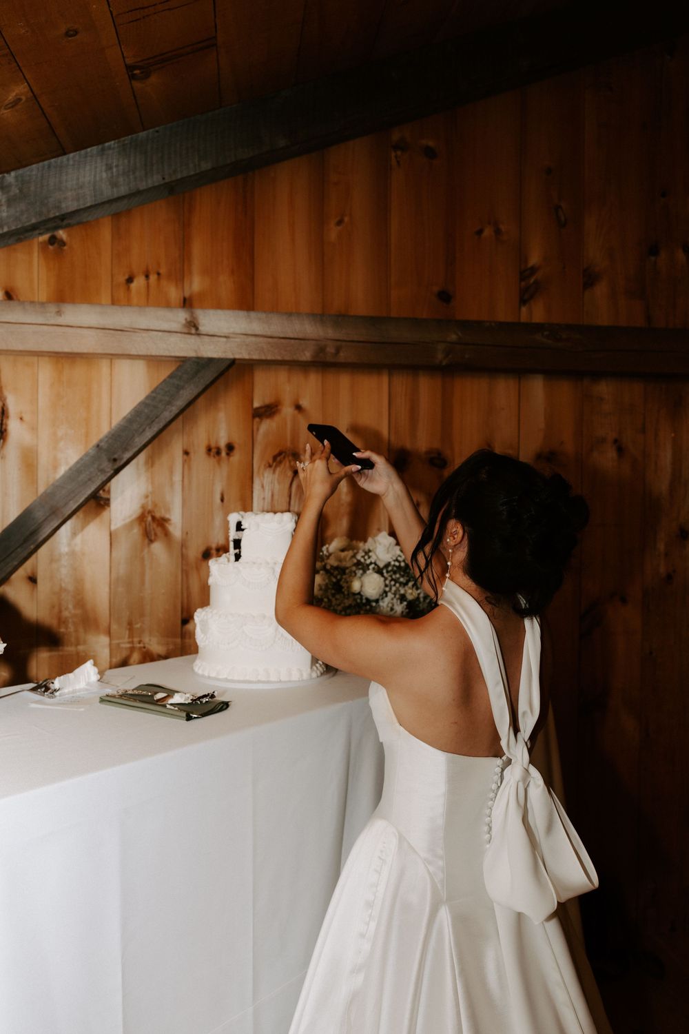 Wedding cake moments captured by Local Roots Photography.