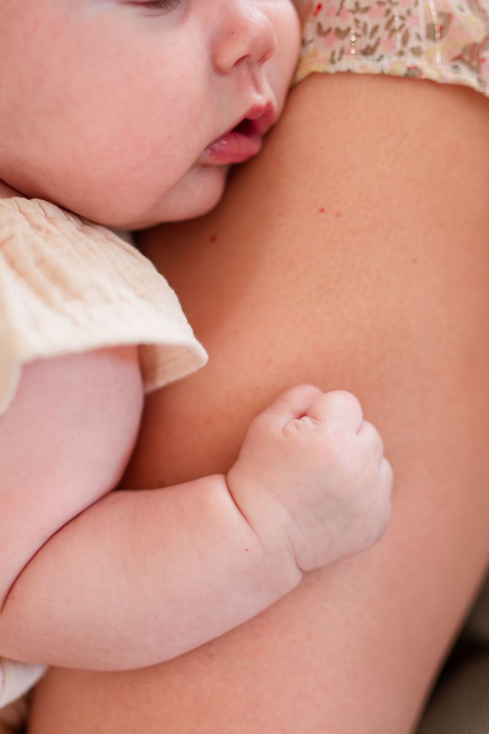 Close-up sequence of a baby breastfeeding, showing tender moments of bonding and nourishment.