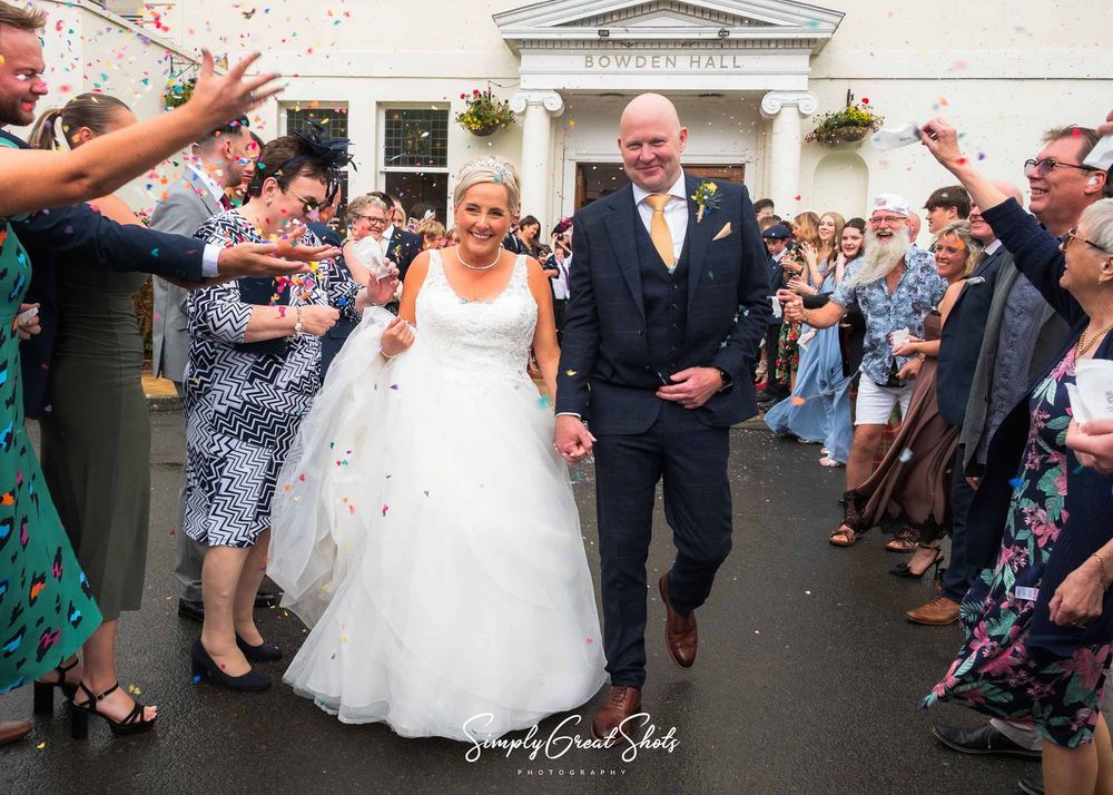Bowden Hall wedding photographer captures Mark and Lisa during their confetti shot exit.