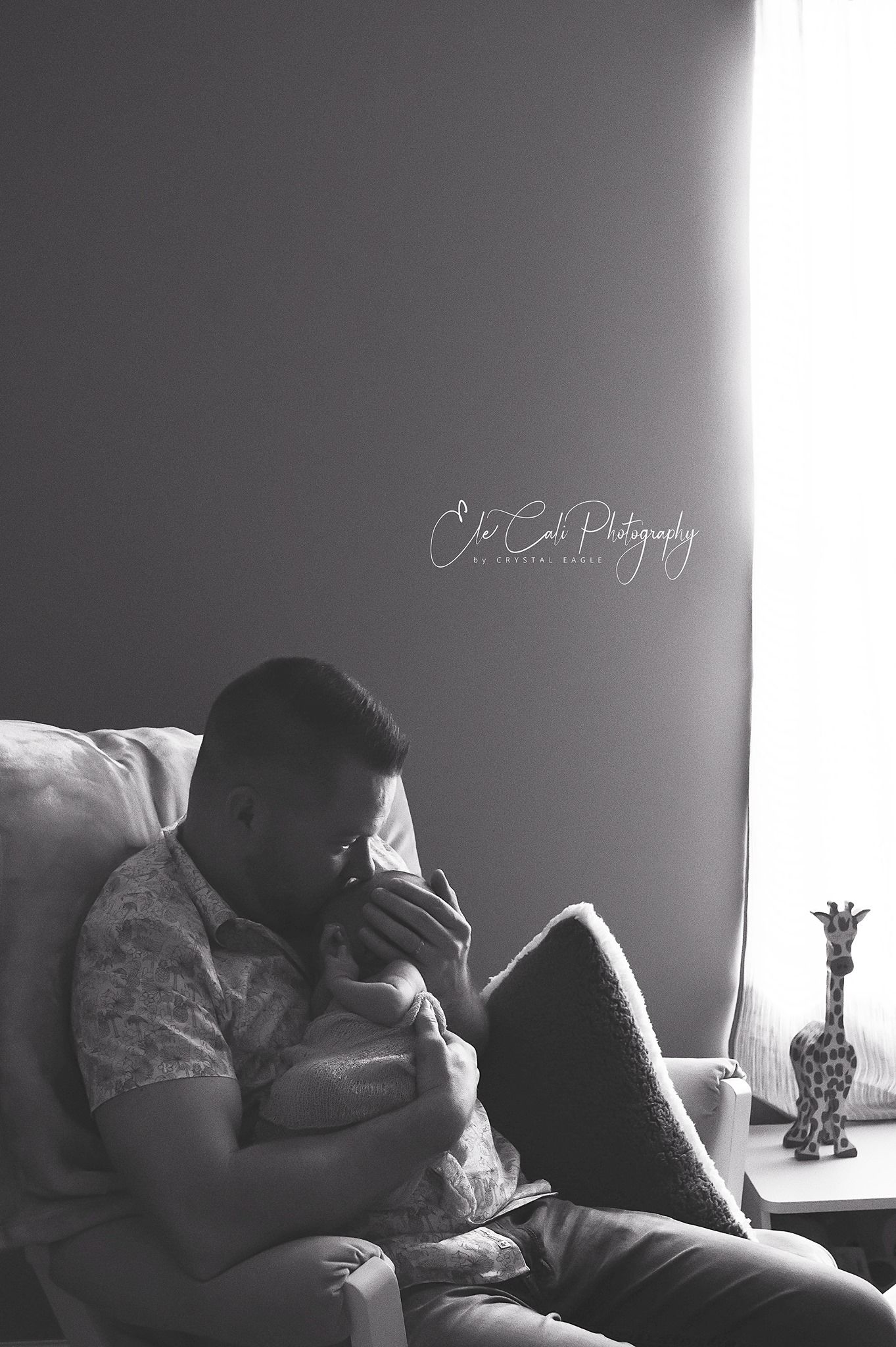 Intimate black and white portrait in natural window light.
