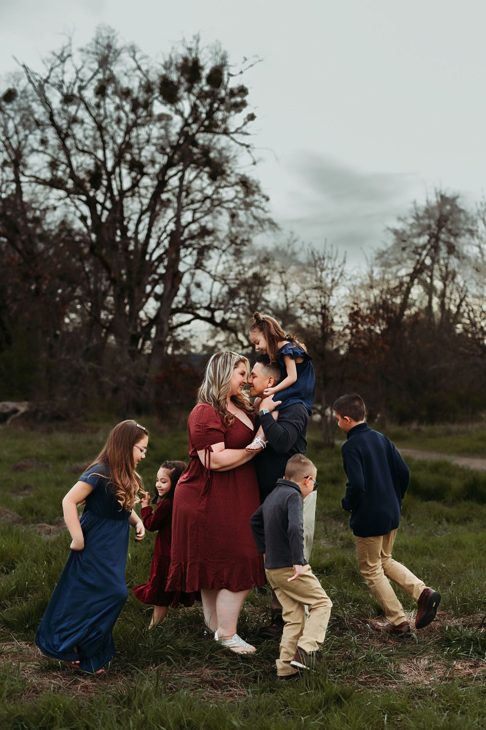 Family photos with the kids running around while the parents snuggle.