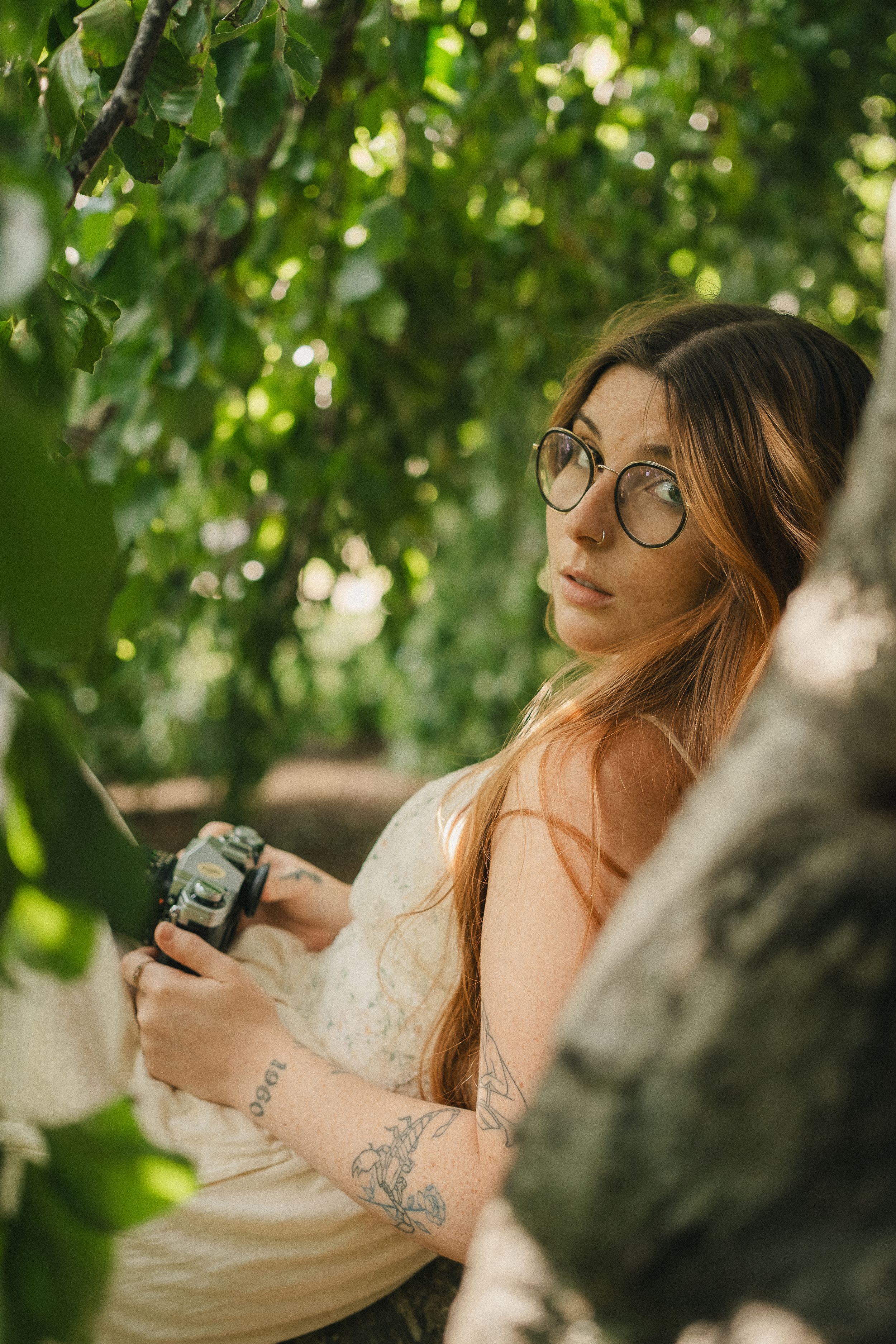 Kaitlyn Yvette Newfoundland Wedding Photographer with film camera