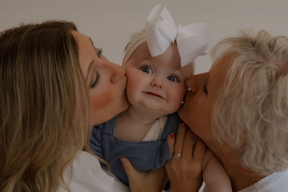 A series of loving candid moments captured against a simple beige background.