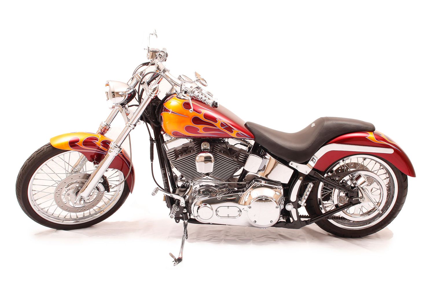 Five custom motorcycles lined up in a row showcasing different styles and colors of chopper bikes.