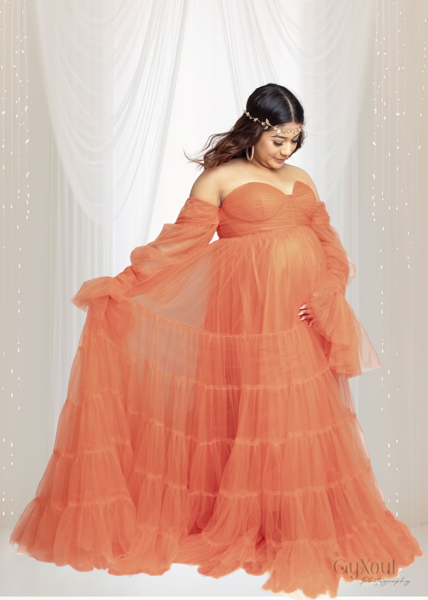 Flowy coral tulle gown with tiered ruffles and off-shoulder design shown from multiple angles on white background.