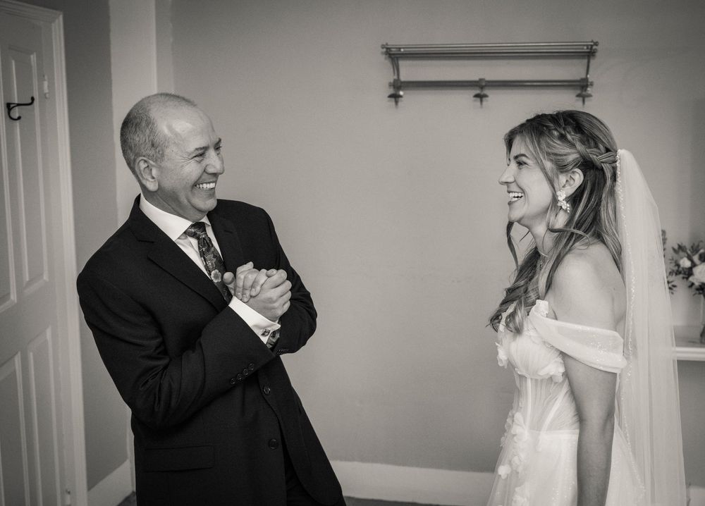 Black and white emotional first look sequence shows tender wedding moments between bride and groom.