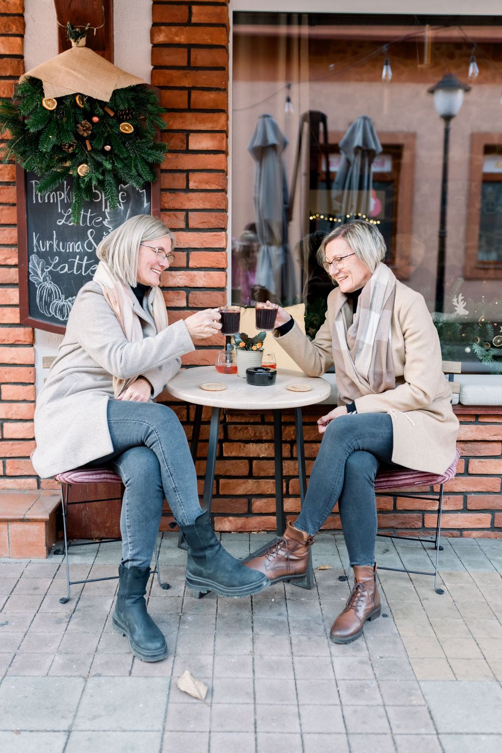 Series of casual outdoor cafe moments showing laughter and conversation on a brick patio.