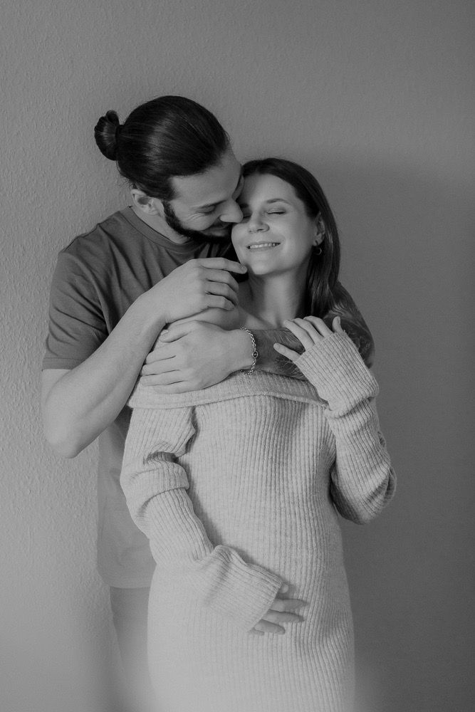 Romantic black and white sequence showing tender moments between a couple in casual attire.