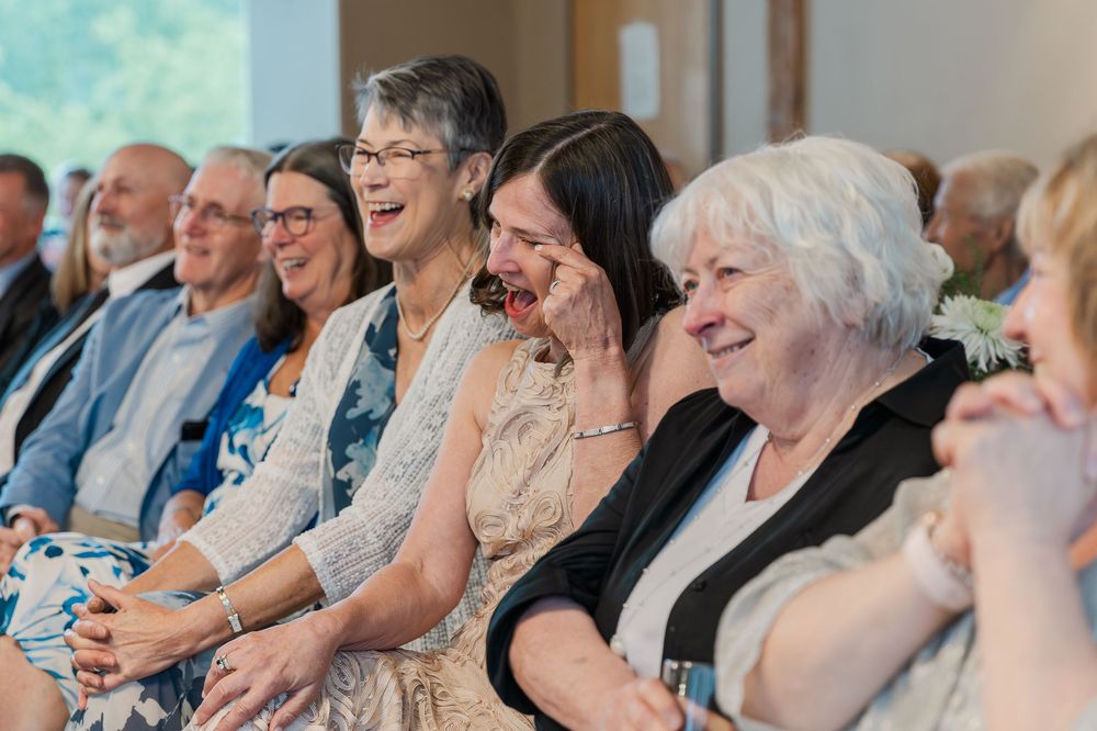 Wedding guests seated in rows watching ceremony with expressions of joy and emotion in Guelph, Ontario.