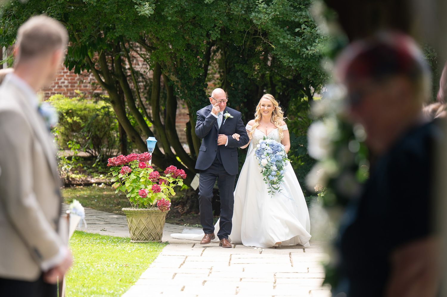 Kent wedding photography at Solton Manor – groom sees bride arriving with her father, emotional moment.