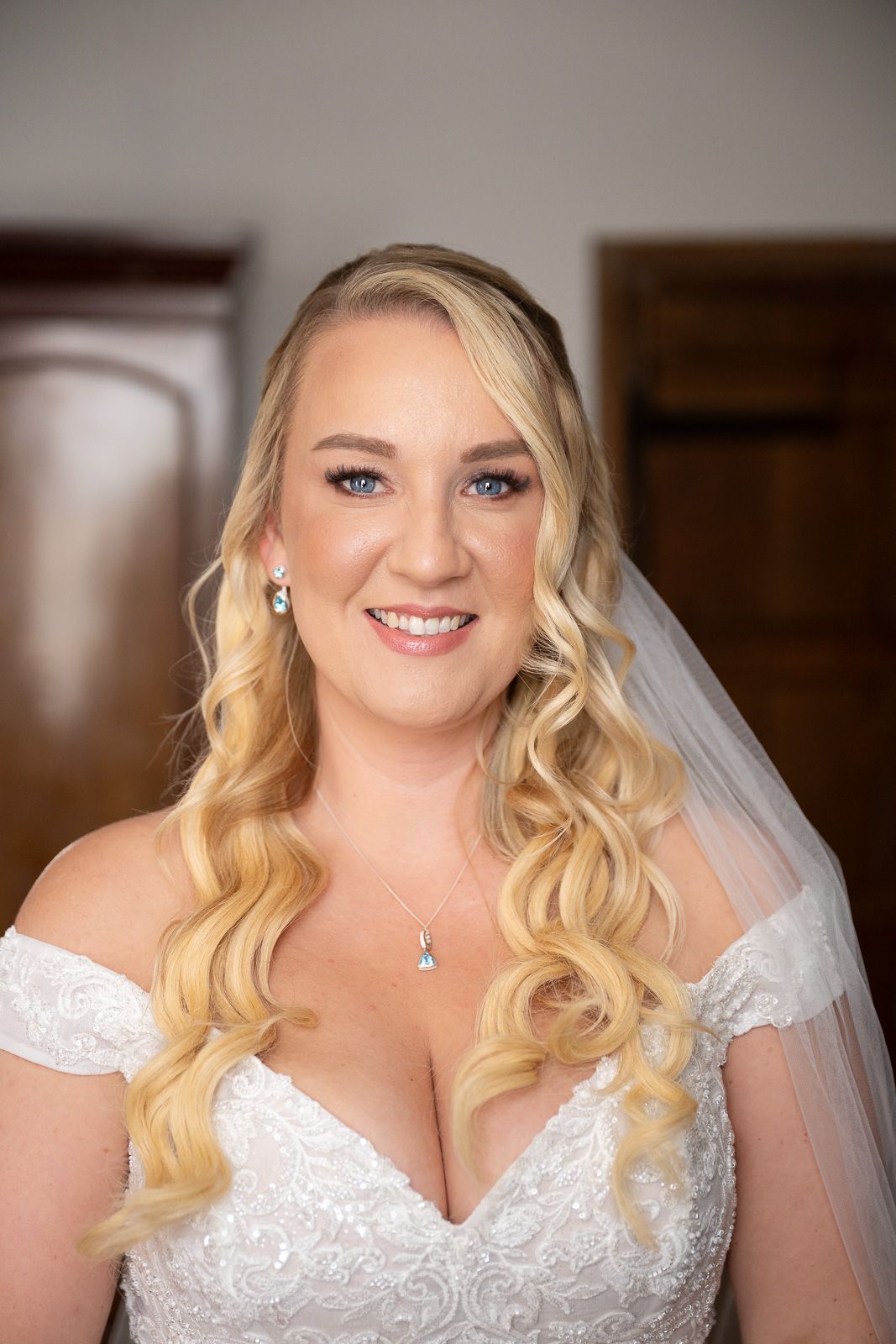 Softly lit bridal portrait of Abi in her Essence of Australia gown, captured by SHOT by JFK at Solton Manor.