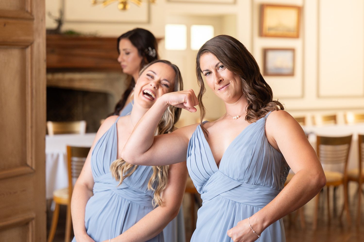 Bridesmaids enjoying playful moment before bridal reveal at Solton Manor, Kent wedding photography.