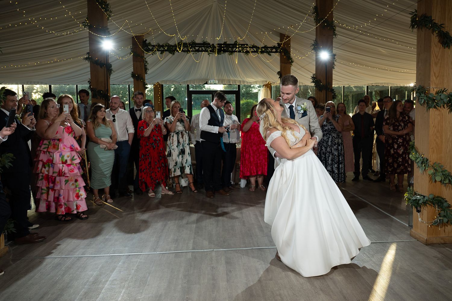 Bride and groom share first dance under creative flash lighting, captured by SHOT by JFK at Solton Manor.