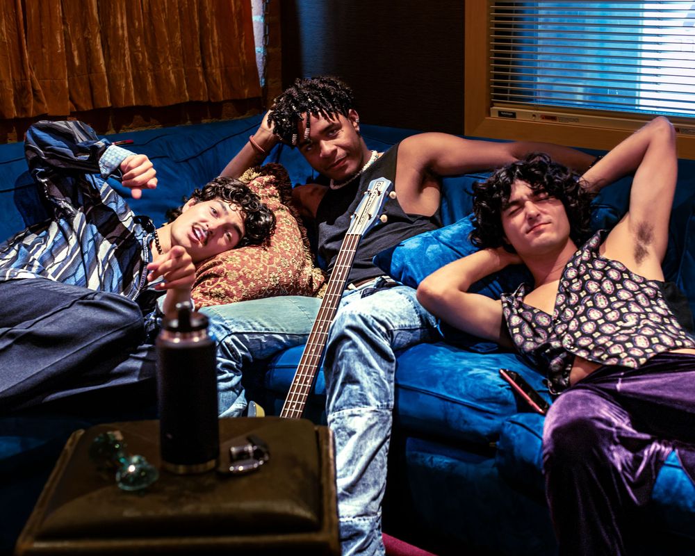 A sequence of people sleeping on couches and chairs in various relaxed positions during the daytime.