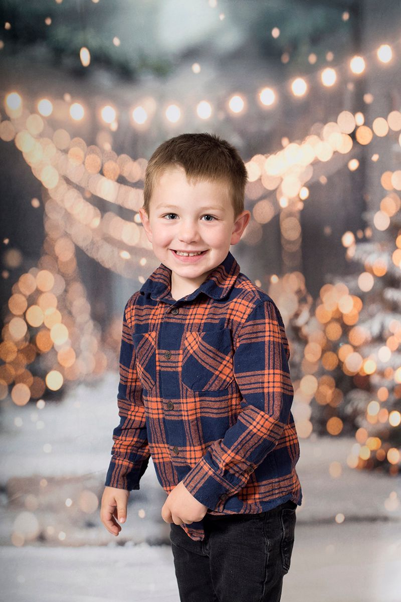 Portrait of a young boy during a festive Winter Wonderland Christmas mini session in High Wycombe, 2025.