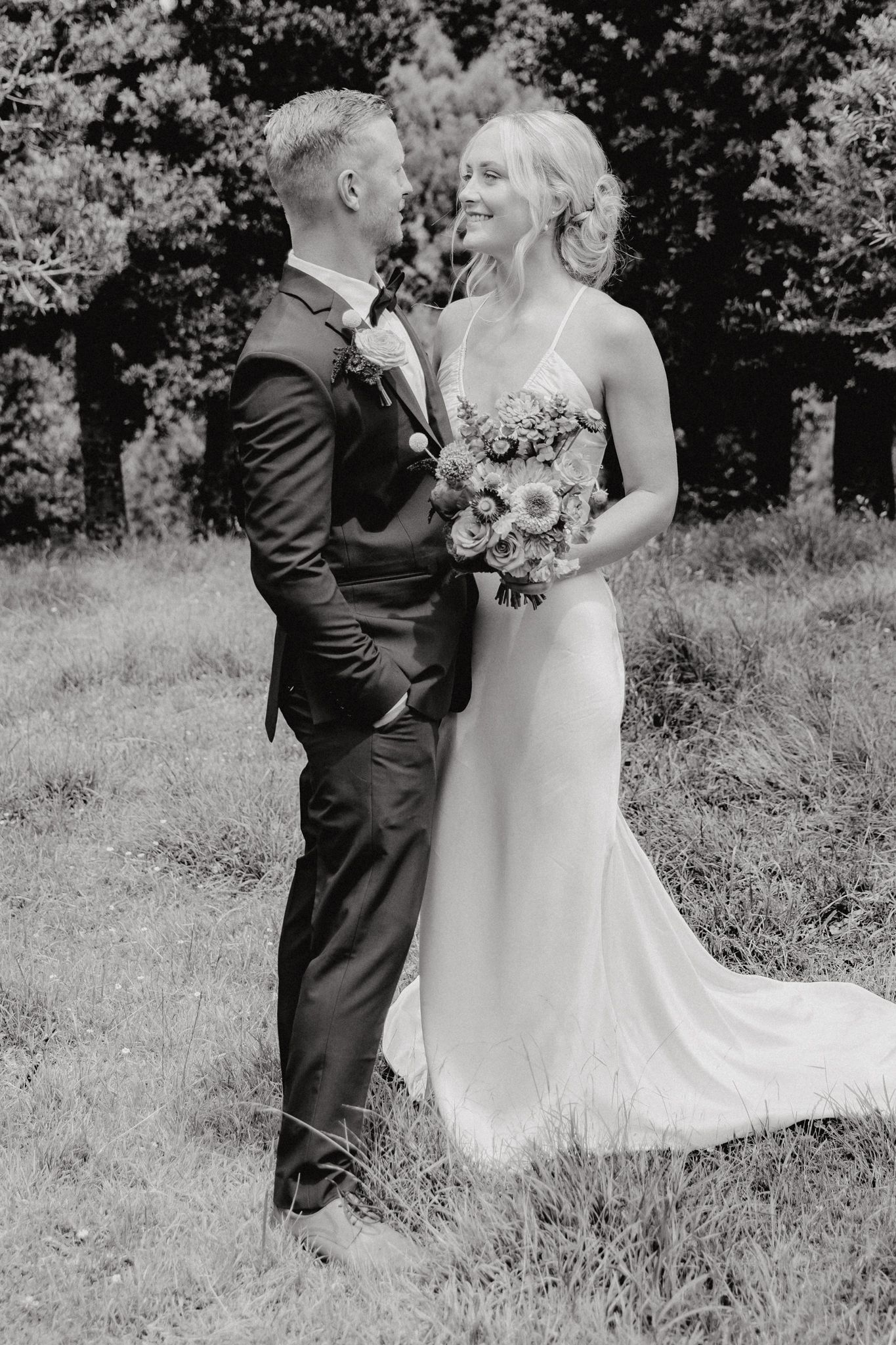 "Couple sharing an intimate moment during their wedding day in Auckland, captured by Apertured Media – Auckland Wedding Photographer."