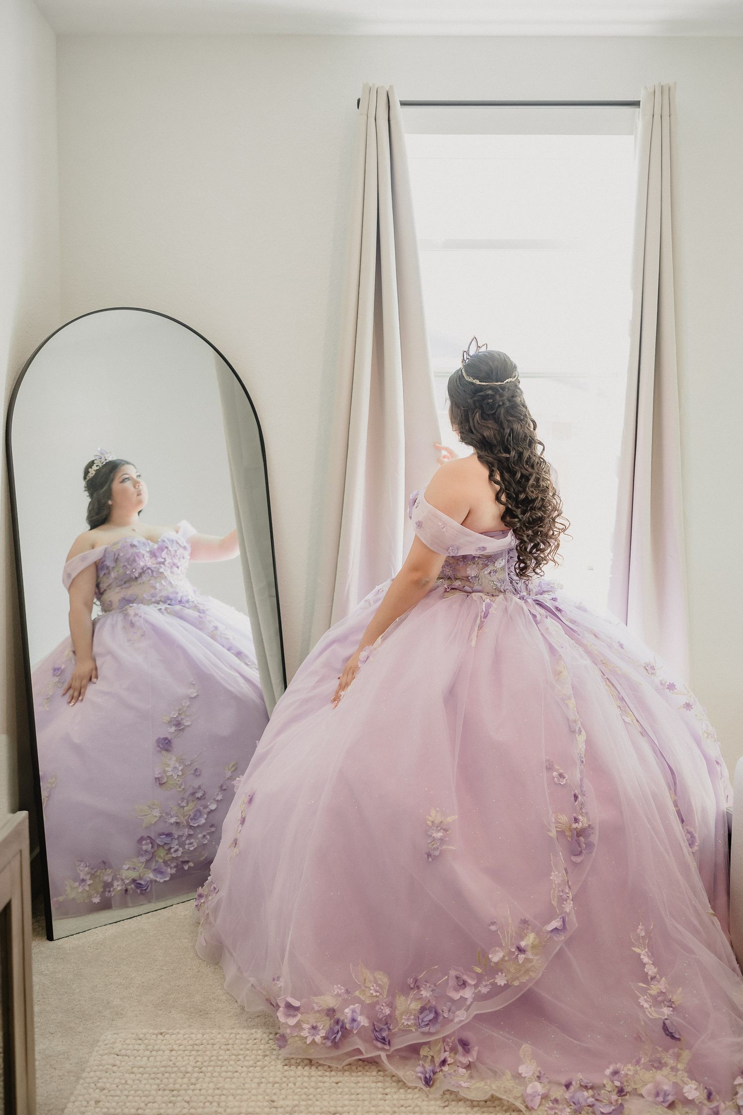 Flowing lavender princess gown with floral embellishments captured in mirror reflections.
