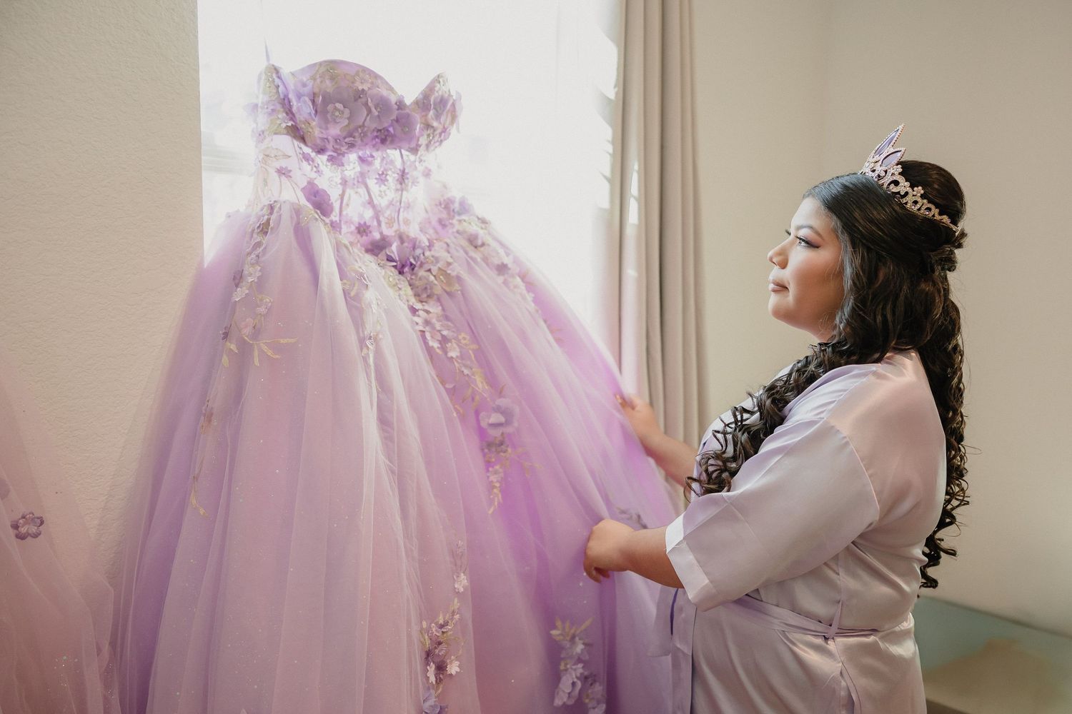 Multiple views of a lavender ballgown wedding dress being fitted in a sunlit dressing room.