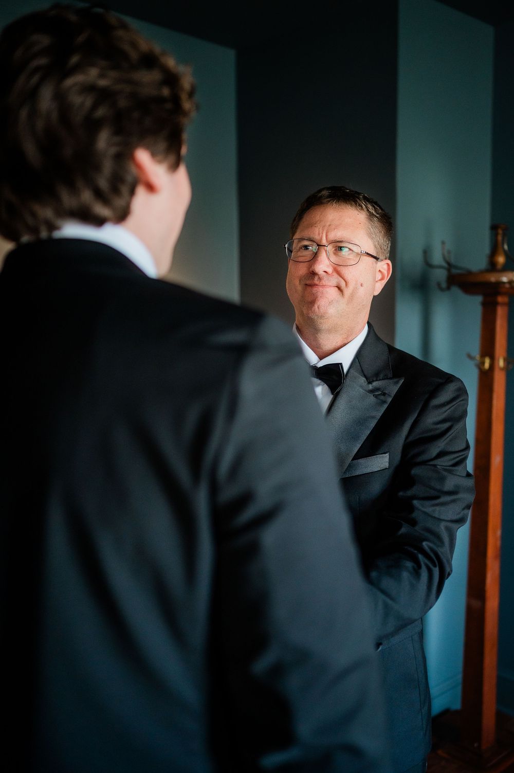A series of intimate wedding preparation moments captured through a mirror reflection.