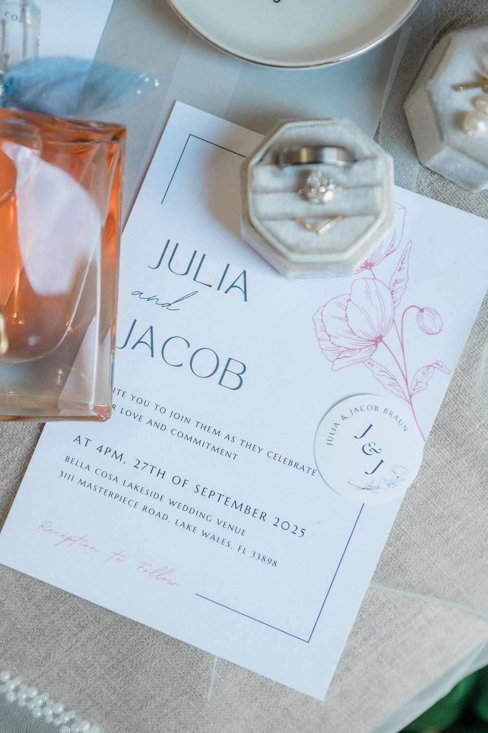 Elegant wedding invitation cards with delicate floral designs and calligraphy details on a neutral background.
