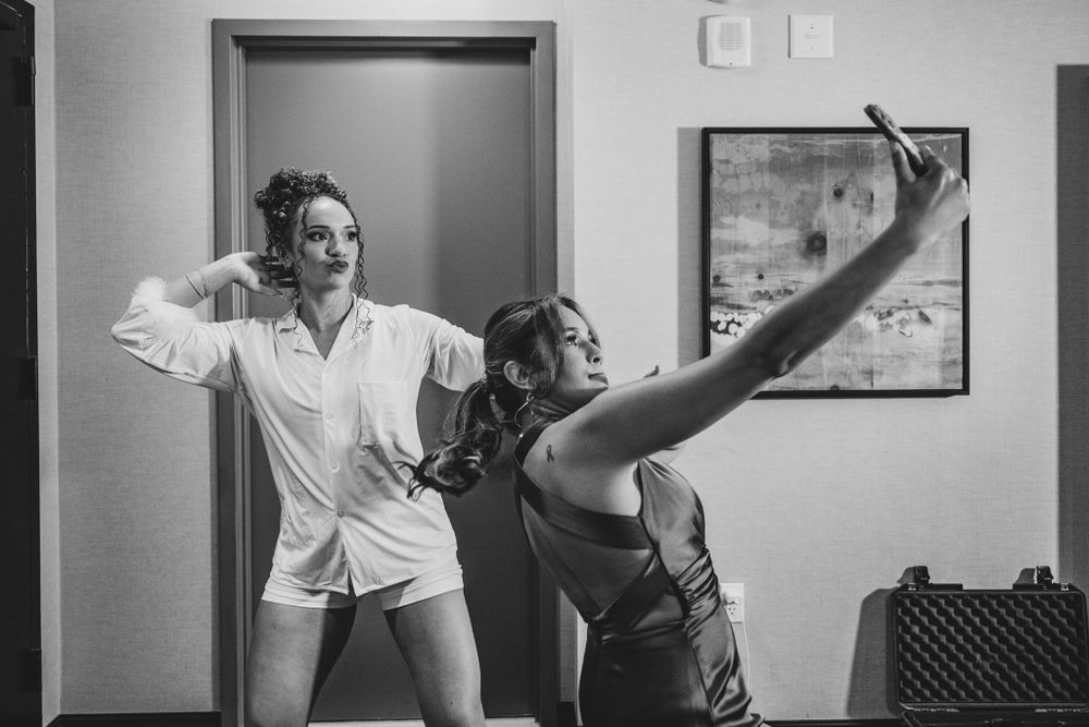 Candid black and white photo capturing spontaneous dancing moments.