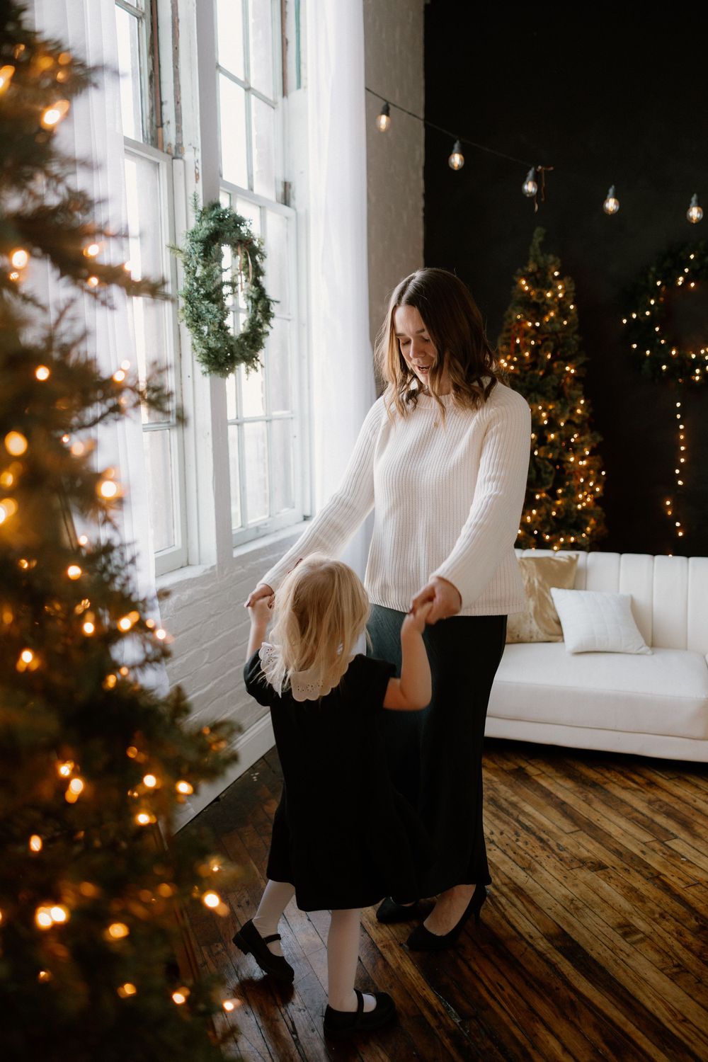 Series of romantic holiday photos with string lights and Christmas decor in a bright sunlit room.