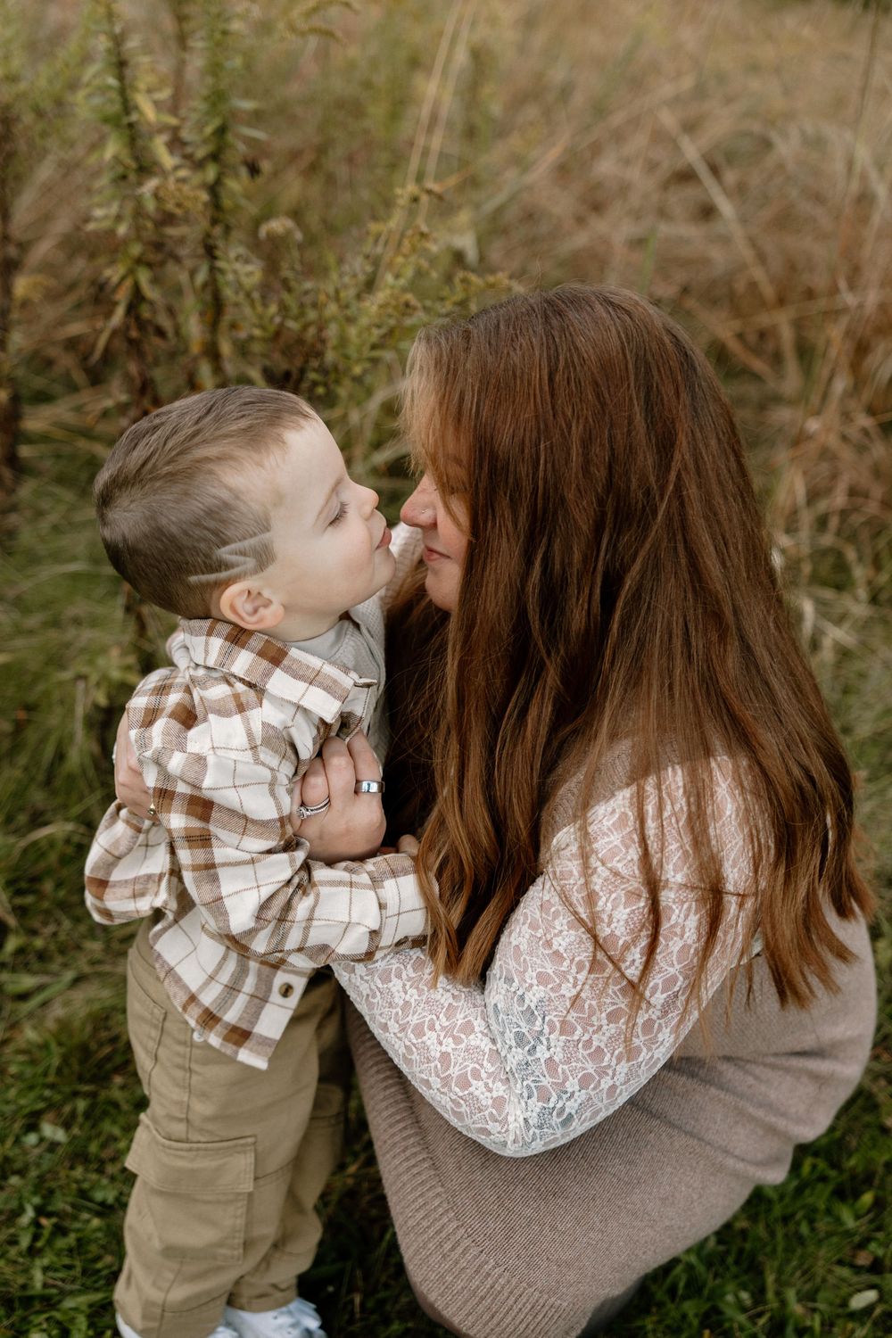 A tender moment captured in a series of photos showing affection between parent and child in an outdoor setting.