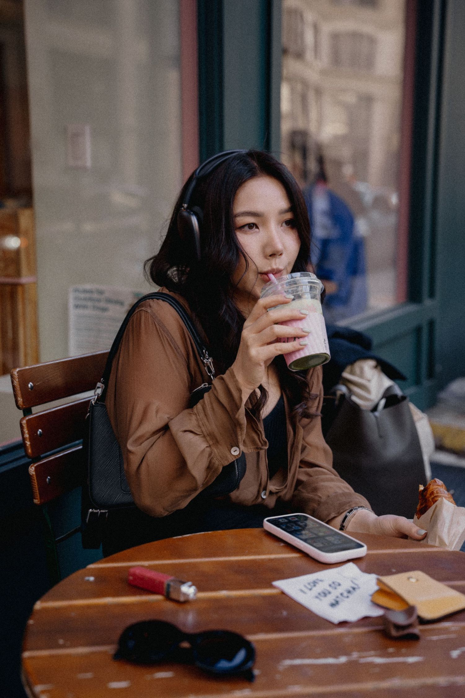 Beautiful woman portrait in a café, showcasing cinematic and aesthetic photography, capturing intimate moments and emotions