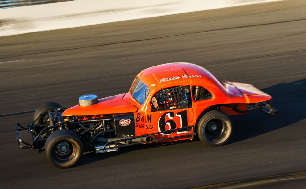 High-speed race car cornering on track during auto racing event, dynamic motorsports branding photo by SRX Media Group