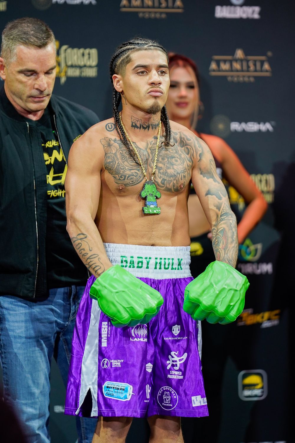 Bare knuckle fighter posing on the scale at pre-fight weigh-in, intense combat sports moment captured by SRX Media Group.