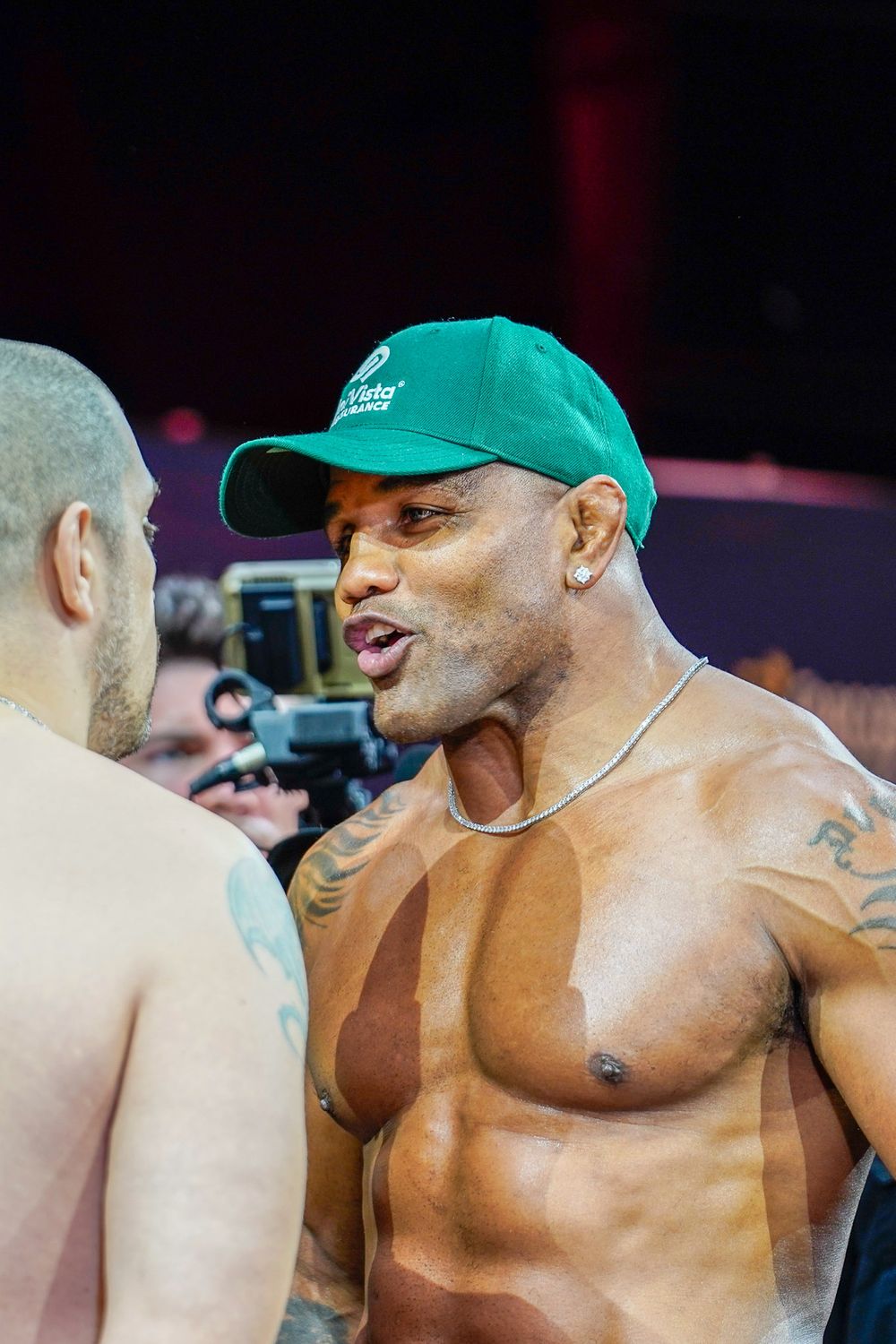Bare knuckle fighter posing on the scale at pre-fight weigh-in, intense combat sports moment captured by SRX Media Group.