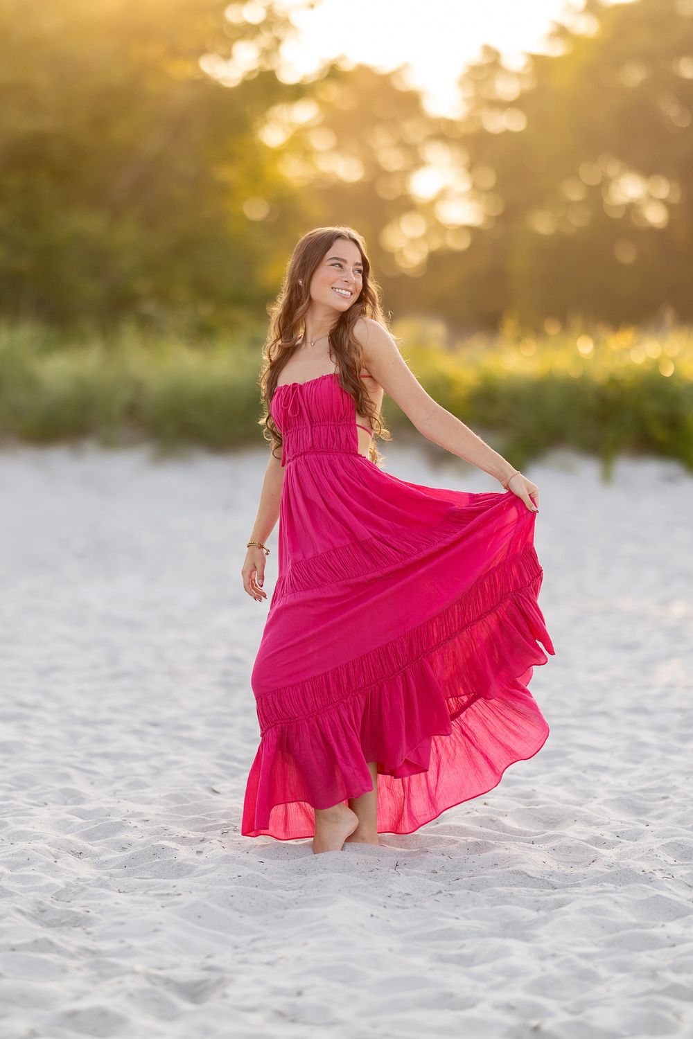 High school senior portrait at sunset in a field at New Castle, NH
