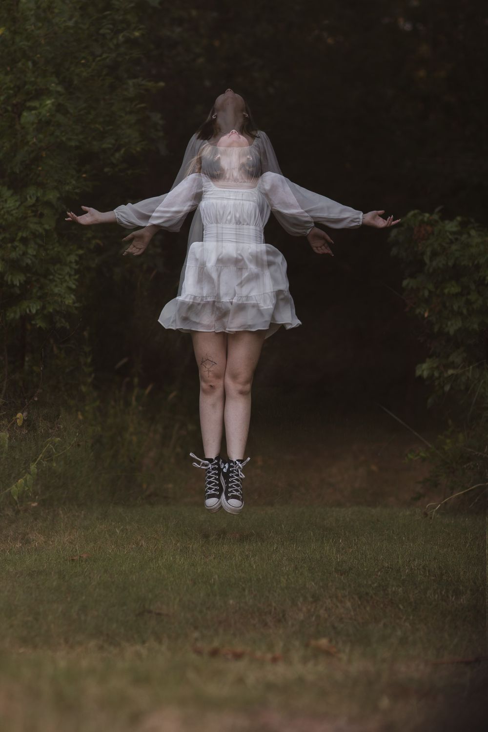 Girl with her spirit coming out of her body during a creative photoshoot in Joplin, Missouri.