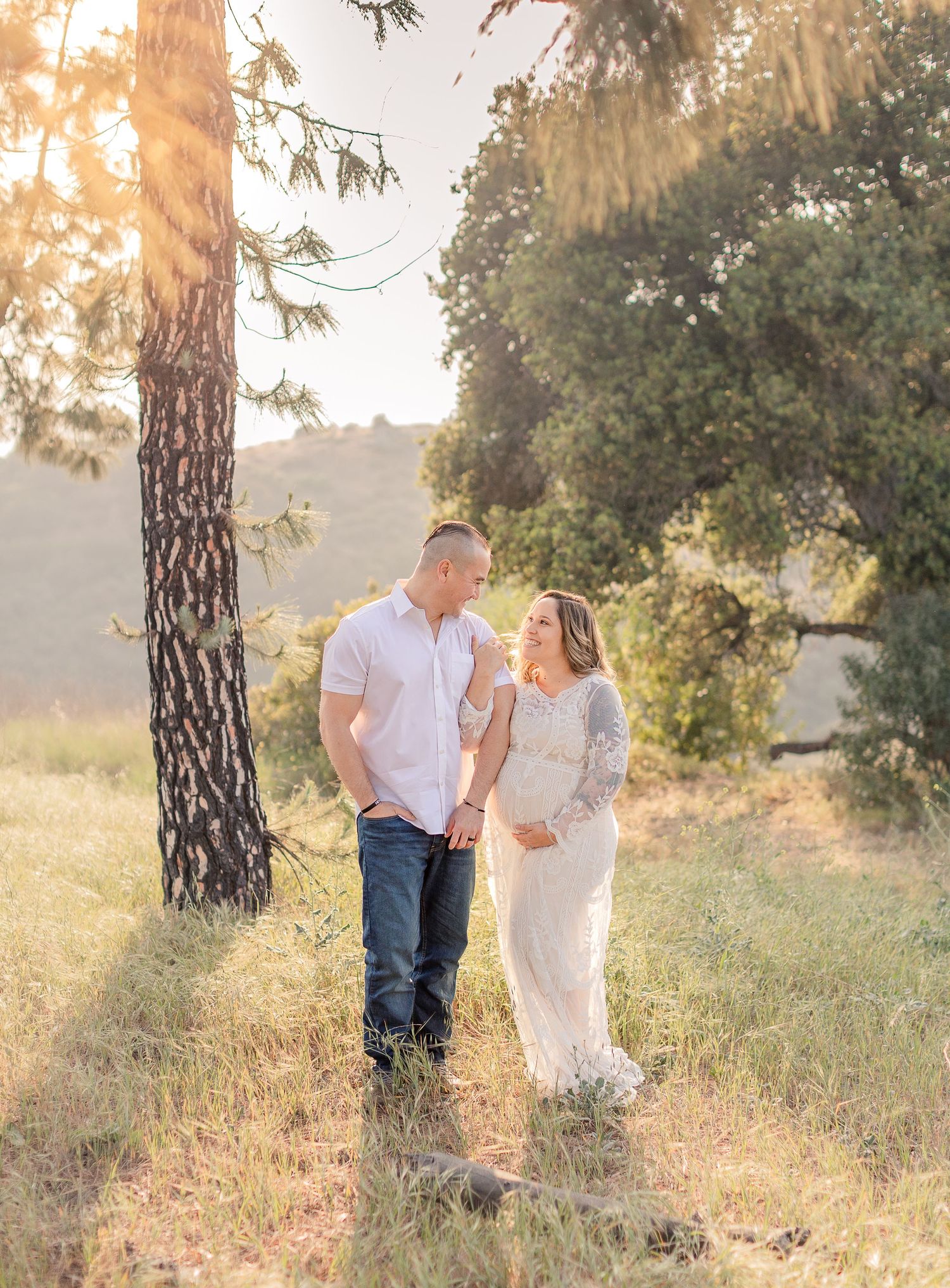 Mama to be and daddy outside fun white maternity gown