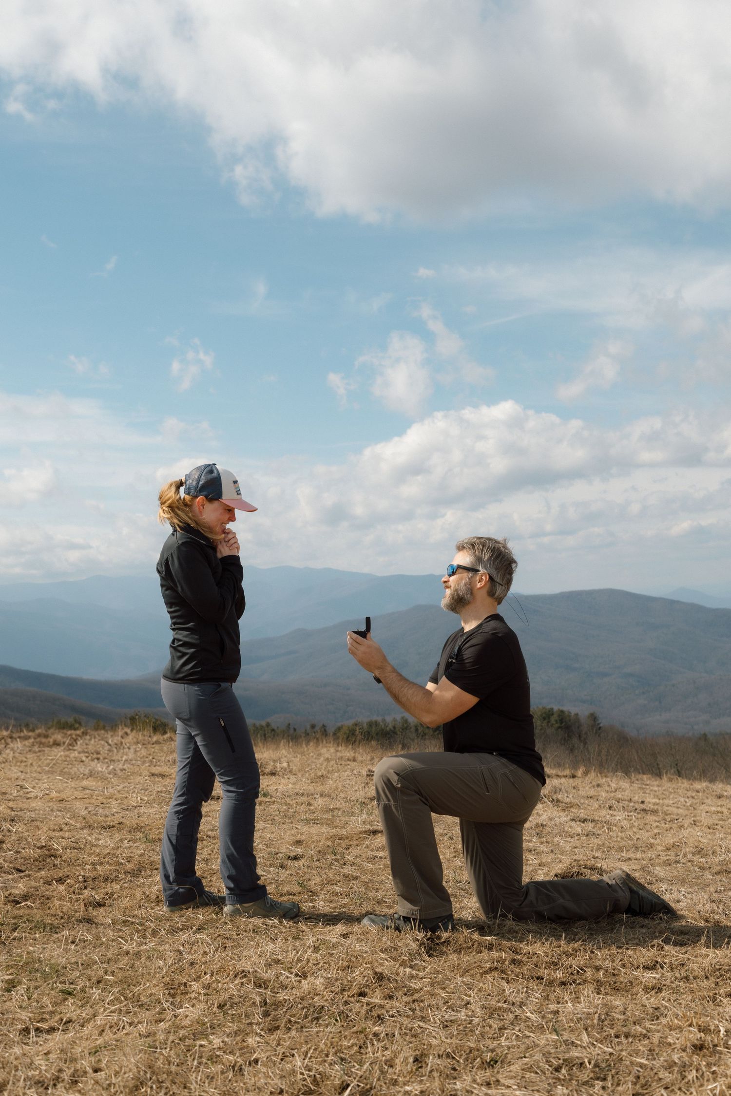 unique couple proposing at blue ridge mountain overlook near Asheville, North Carolina