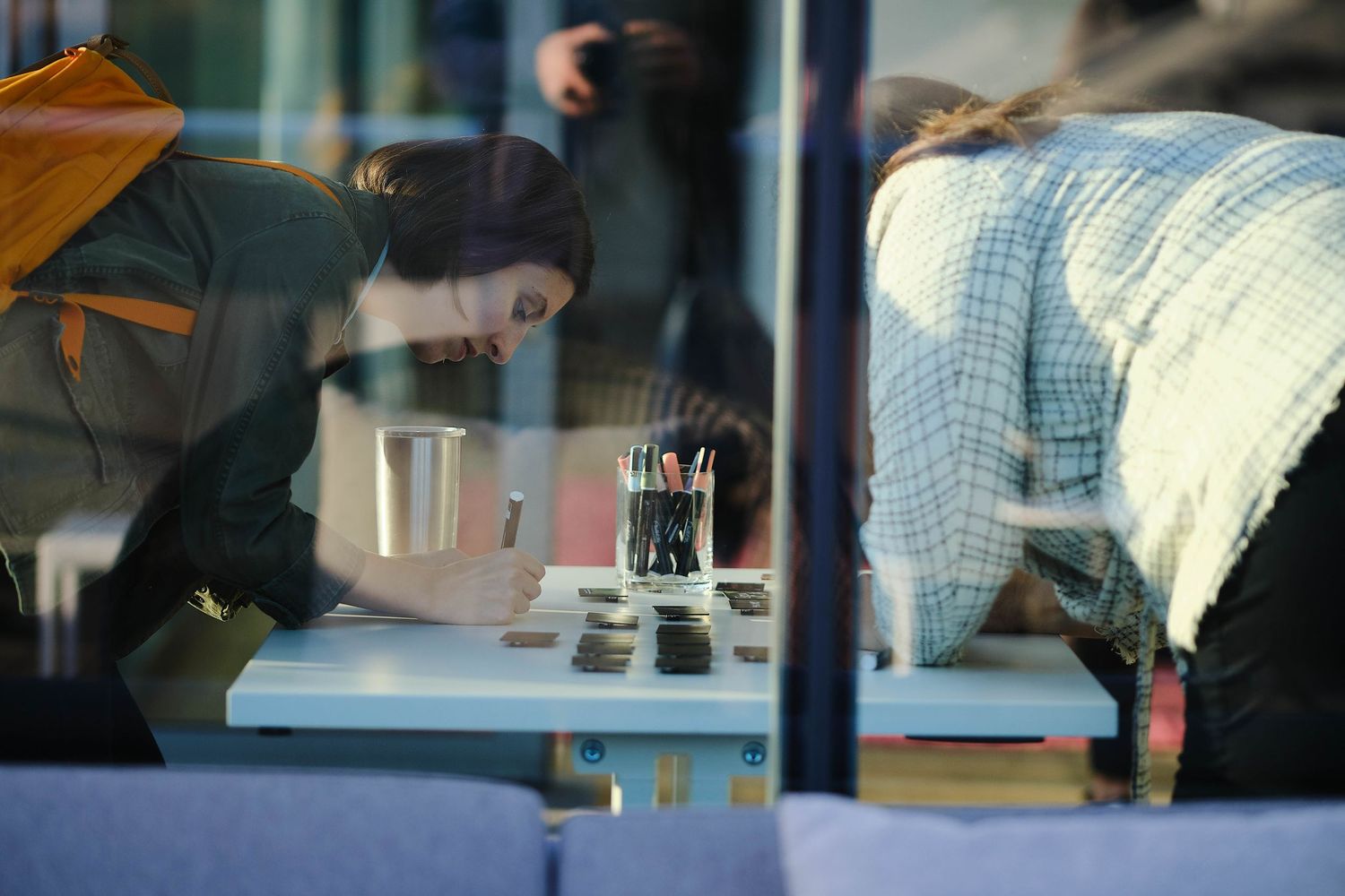 People working together at a desk in an office environment.