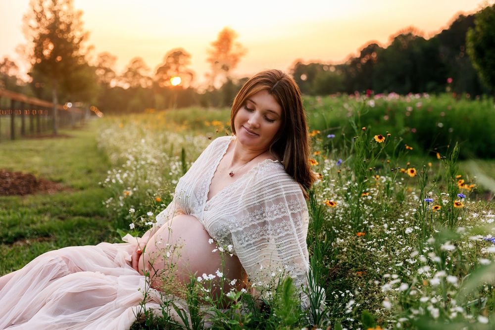 A dreamy scene in a wildflower meadow at golden hour with soft sunlight filtering through the flowers and grass.