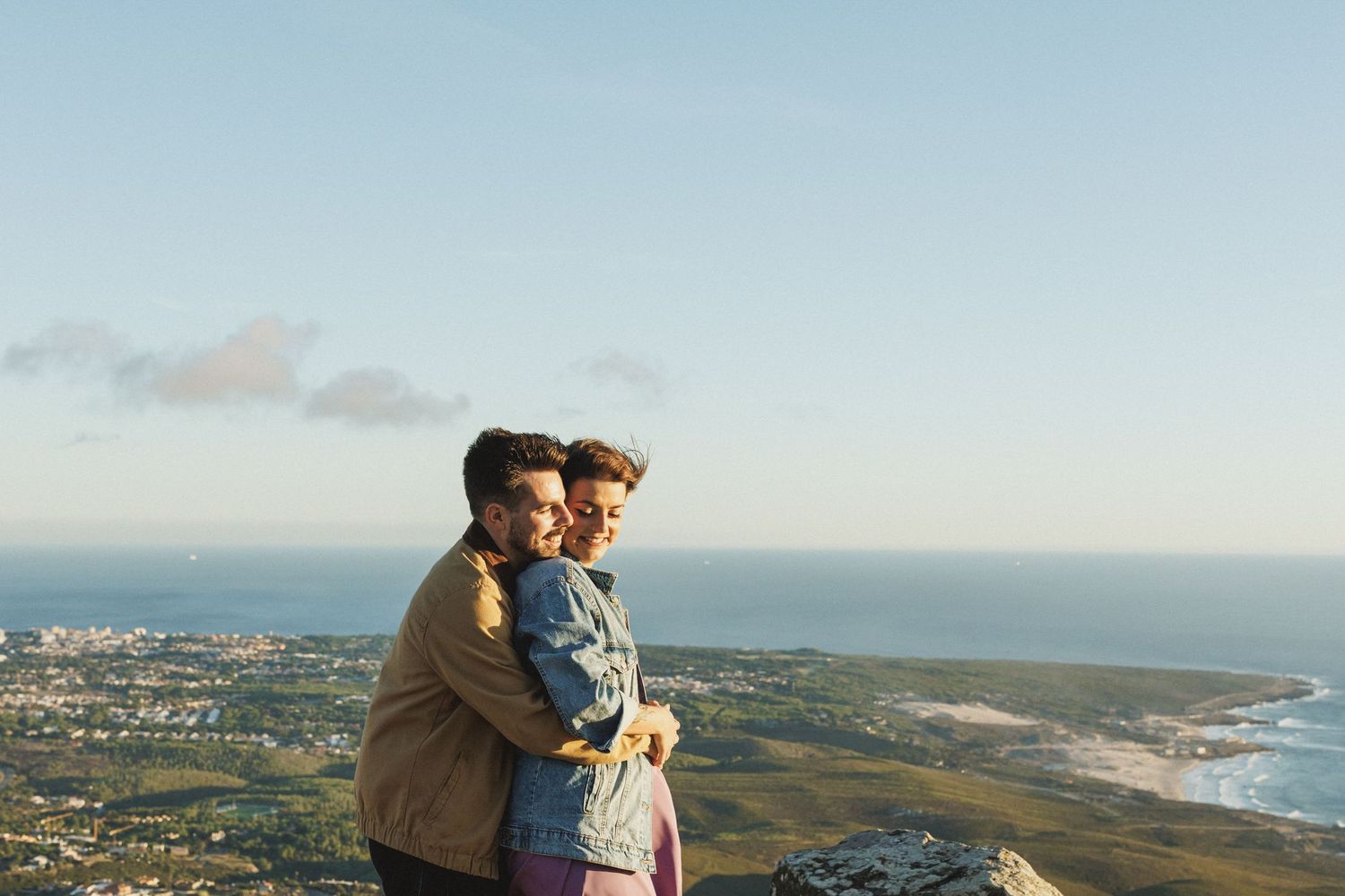 Romantic close-up of couple hugging with Atlantic coastline view in Sintra pre wedding shoot