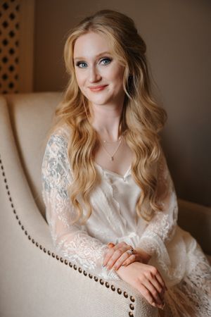 A series of romantic boudoir portraits showing a woman in white lace lounging on an elegant upholstered chair.