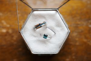 A sequence of photos showing a diamond ring being placed in white salt to clean and restore its sparkle.